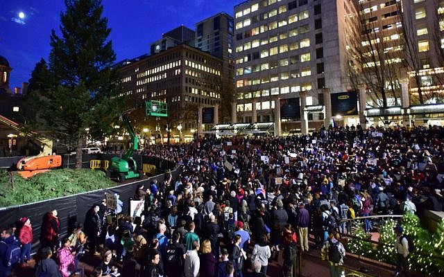 Protesters gather in Pioneer Courthouse Square in Portland, Oregon, the third night of protests over the results of the 2016 US presidential election, Thursday, Nov. 10, 2016. (Mark Graves/The Oregonian/OregonLive.com via AP)