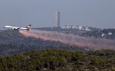 The Evergreen Supertanker plane extinguishes a forest fire near the northern city of Haifa, Israel on December 5, 2010. (Abir Sultan/Flash90) The Evergreen Supertanker plane extinguishes a forest fire near the northern city of Haifa, Israel on December 5, 2010. (Abir Sultan/Flash90)