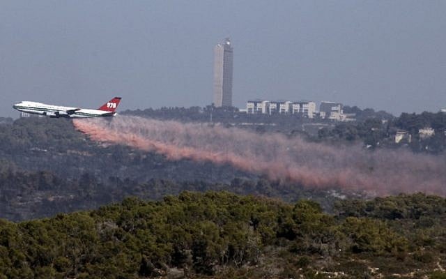 The Evergreen Supertanker plane extinguishes a forest fire near the northern city of Haifa, Israel on December 5, 2010. (Abir Sultan/Flash90) The Evergreen Supertanker plane extinguishes a forest fire near the northern city of Haifa, Israel on December 5, 2010. (Abir Sultan/Flash90)