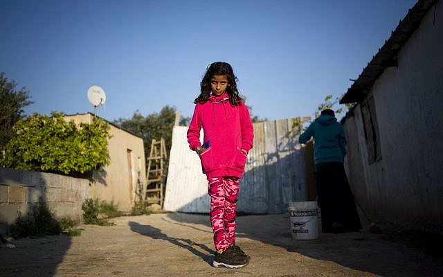 An Israeli Arab Bedouin girl poses for a picture at her home in Umm Al-Hiran, southern Israel, March 30, 2016. (Corinna Kern/Flash90) An Israeli Arab Bedouin girl poses for a picture at her home in Umm Al-Hiran, southern Israel, March 30, 2016. (Corinna Kern/Flash90)