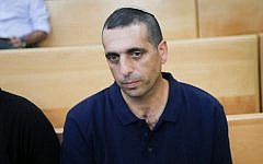 Ofek Buchris, the former military brigadier general accused of rape and other sexual crimes against subordinates, seen at the Jaffa military court on September 29, 2016. (Flash90)