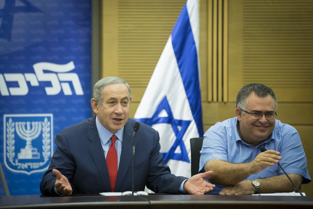 Prime Minister Benjamin Netanyahu (left) and MK David Bitan attend a Likud faction meeting in the Knesset, October 31, 2016. (Miriam Alster/FLASH90) Prime Minister Benjamin Netanyahu (left) and MK David Bitan attend a Likud faction meeting in the Knesset, October 31, 2016. (Miriam Alster/FLASH90)