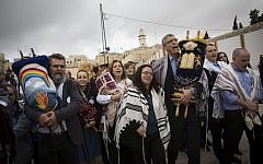 A group of American Conservative and Reform rabbis and members of the Women of the Wall carry Torah scrolls during a protest march against the government’s failure to deliver a new prayer space, at the Western Wall in Jerusalem's Old City, November 2, 2016. (Hadas Parush/Flash90)