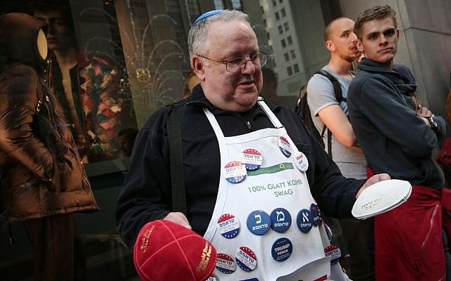 A supporter of Donald Trump with pins bearing his name in Hebrew, outside the Trump Tower in New York City, USA, on November 8, 2016. (Noam Revkin FentonFlash90) A supporter of Donald Trump with pins bearing his name in Hebrew, outside the Trump Tower in New York City, USA, on November 8, 2016. (Noam Revkin FentonFlash90)