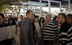 People protest outside Habima Theater in Tel Aviv, against one of their productions being shown in the settlement of Kiryat Arba, outside of the West Bank city of Hebron, November 9, 2016 (Tomer Neuberg/Flash90)