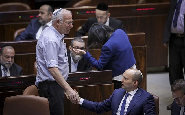 Jewish Home leader Naftali Bennett (sitting) with Jewish Home MK Uri Ariel during a plenum session on the so-called Regulation Bill, November 16, 2016. (Yonatan Sindel/Flash90) Jewish Home leader Naftali Bennett (sitting) with Jewish Home MK Uri Ariel during a plenum session on the so-called Regulation Bill, November 16, 2016. (Yonatan Sindel/Flash90)