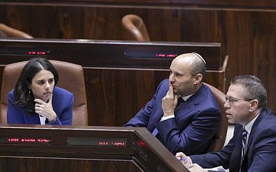 Jewish Home leader Education Minister Naftali Bennett, center, with fellow Jewish Home lawmaker Justice Minister Ayelet Shaked, right, and Public Security Minister Gilad Erdan during a plenum vote on the Regulation Bill on November 16, 2016. (Yonatan Sindel/Flash90)