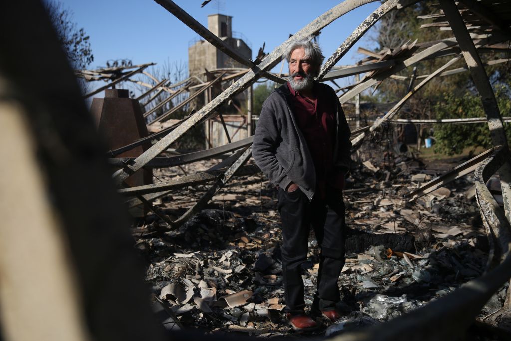 An Israeli artist stands in his studio, burned in an overnight fire in Beit Meir, outside of Jerusalem on November 25, 2016. (Hadas Parush/Flash90) An Israeli artist stands in his studio, burned in an overnight fire in Beit Meir, outside of Jerusalem on November 25, 2016. (Hadas Parush/Flash90)
