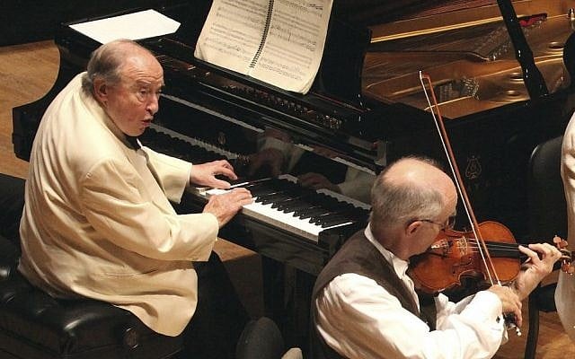 In this Aug. 20, 2013 photo provided by the Boston Symphony Orchestra, Pianist Menahem Pressler, left, performs with Boston Symphony Chamber Players at Tanglewood in Stockbridge, Mass. Pressler. (Hilary Scott/Boston Symphony Orchestra via AP) In this Aug. 20, 2013 photo provided by the Boston Symphony Orchestra, Pianist Menahem Pressler, left, performs with Boston Symphony Chamber Players at Tanglewood in Stockbridge, Mass. Pressler. (Hilary Scott/Boston Symphony Orchestra via AP)