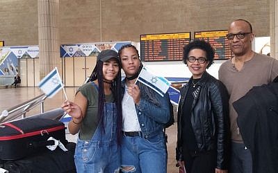 Amy and George Camara and two of their four children arriving in Israel, Nov. 2, 2016. (JTA/ Courtesy of the International Fellowship of Christians and Jews)