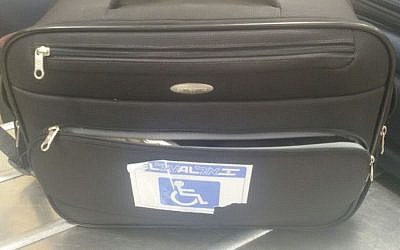 The suitcase in which rare Uzbek pigeons were hidden, during a smuggling attempt thwarted at Ben Gurion Airport. The bag had a disabled luggage tag in order to avoid suspicion. (Agriculture Ministry)