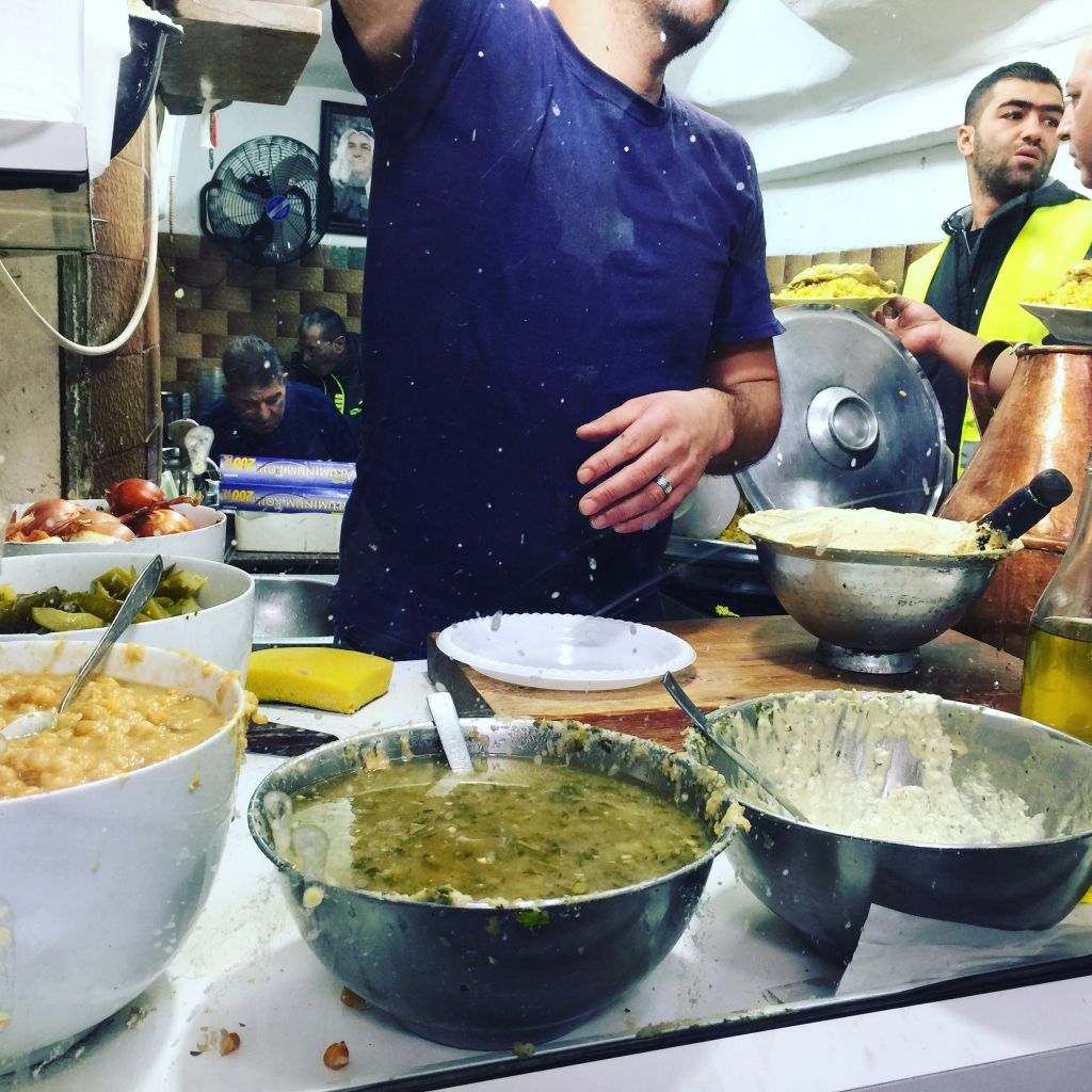 Vats of hummus ready for the lunchtime rush (Jessica Steinberg/Times of Israel)