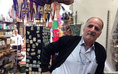 Shaban R in his souvenir shop on Christian Quarter road on November 9, 2016 (Tamar Pileggi/Times of Israel)