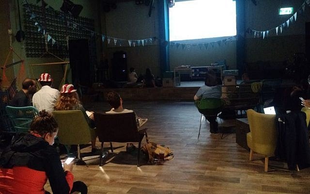 Democratic supporters in Tel Aviv watch election night coverage on November 9, 2016. (Judah Ari Gross/ Times of Israel)