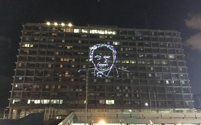 A portrait of Yitzhak Rabin light up the municipal building in Tel Aviv as tens of thousands gather in Rabin Square to mark the 21st anniversary of the prime minister's assassination on November 5, 2016 (Iacopo Luzi)