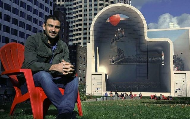 In this Friday, Nov. 11, 2016 photo, Mehdi Ghadyanloo, from Tehran, Iran, poses with his mural, "Spaces of Hope," on the Rose Kennedy Greenway in Boston. (AP Photo/Bill Sikes) In this Friday, Nov. 11, 2016 photo, Mehdi Ghadyanloo, from Tehran, Iran, poses with his mural, "Spaces of Hope," on the Rose Kennedy Greenway in Boston. (AP Photo/Bill Sikes)