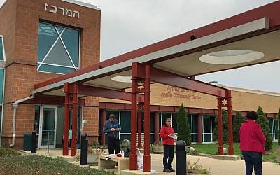 Last-minute campaigners greet voters at the Indianapolis Jewish Community Center as they enter the polls on November 8, 2016. (Amanda Borschel-Dan/The Times of Israel)