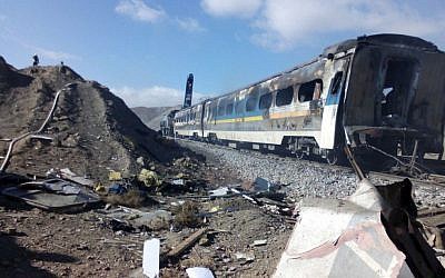 This picture released by Iranian Fars News Agency shows the scene of two trains collision about 150 miles (250 kilometers) east of the capital Tehran, Iran, Friday, Nov. 25, 2016. (Saeed Esmaeilpour, Fars News Agency via AP)