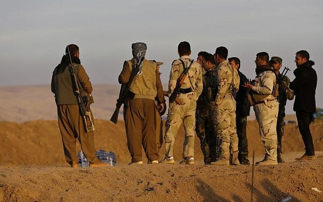 Kurdish Peshmerga fighters stand at a crossing point where Iraqis fleeing the fighting between Iraqi forces and Islamic State militants cross to the Kurdish controlled area, in the Nineveh plain, northeast of Mosul, Nov. 17, 2016 (AP Photo/Hussein Malla) Kurdish Peshmerga fighters stand at a crossing point where Iraqis fleeing the fighting between Iraqi forces and Islamic State militants cross to the Kurdish controlled area, in the Nineveh plain, northeast of Mosul, Nov. 17, 2016 (AP Photo/Hussein Malla)