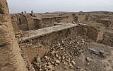 Journalists walk at the damaged ancient site of Nimrud, which was destroyed by the Islamic State militants, southeast of Mosul, Iraq, seen here on November 16, 2016. (AP/Hussein Malla)