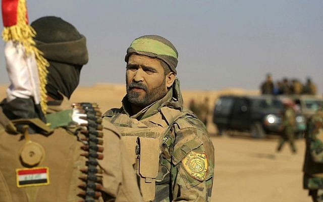 Fighters of the Popular Mobilization Forces stand at the front line against Islamic State militants outside Mosul, Iraq, Saturday, Nov. 26, 2016. (AP Photo/Anmar Khalil) Fighters of the Popular Mobilization Forces stand at the front line against Islamic State militants outside Mosul, Iraq, Saturday, Nov. 26, 2016. (AP Photo/Anmar Khalil)