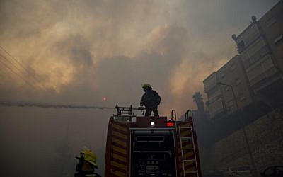 Firefighters fight wildfires in Haifa, Israel, Thursday, Nov. 24, 2016. (AP Photo/Ariel Schalit)