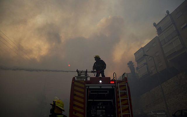 Firefighters fight wildfires in Haifa, Israel, Thursday, Nov. 24, 2016. (AP Photo/Ariel Schalit)
