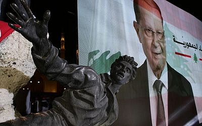 A giant picture of the newly-elected Lebanese President Michel Aoun is seen behind the Statue of Martyrs created by Italian artist Marino Mazzacurati, during a rally at Martyrs Square in downtown Beirut, Lebanon, Monday, Oct. 31, 2016. Lebanon's parliament on Monday elected Michel Aoun, an 81-year-old former army commander and strong ally of the militant group Hezbollah, as the country's president, ending a more than two-year vacuum in the top post and a political crisis that brought state institutions perilously close to collapse. Arabic on the picture reads "Republic". (AP Photo/Hassan Ammar)