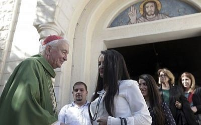 Cardinal Vincent Nichols, Archbishop of Westminster, greets worshipers after a Sunday mass at the Holy Family Catholic Church in Gaza City, November 6, 2016. (AP Photo/ Khalil Hamra)