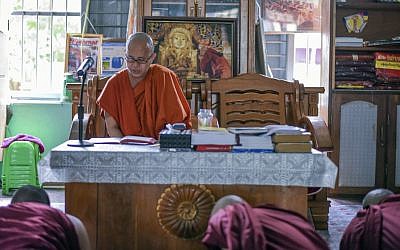 In this Nov. 12, 2016 photo, Wirathu, a high-profile leader of the Myanmar Buddhist organization known as Ma Ba Tha, teaches some younger novice monks at his monastery in Mandalay, Myanmar. (AP/Aung Naing Soe)