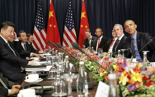 US President Barack Obama, right, and China's President Xi Jingping, left, sit with members of their delegations for a meeting during the Asia-Pacific Economic Cooperation (APEC) in Lima, Peru, on Saturday, Nov. 19, 2016. (AP Photo/Pablo Martinez Monsivais)