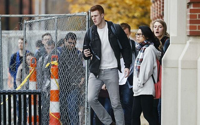 Students leave buildings as police respond to an attack on campus at Ohio State University, Monday, Nov. 28, 2016, in Columbus, Ohio. (AP Photo/John Minchillo)