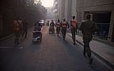 Troops from the IDF's Home Front Command assist in evacuations in Haifa in light of a massive fire in parts of the city on November 24, 2016. (IDF Spokesperson's Unit)