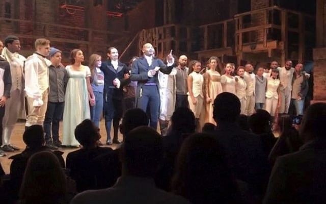 In this image made from a video provided by Hamilton LLC, actor Brandon Victor Dixon who plays Aaron Burr, the nation’s third vice president, in 'Hamilton' speaks from the stage after the curtain call in New York, November 18, 2016. (Hamilton LLC via AP)