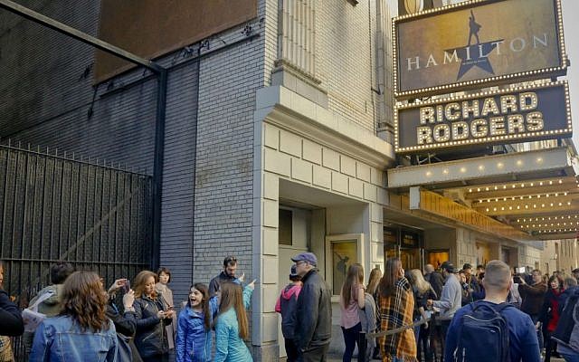 People line up to see the Broadway play "Hamilton," Saturday Nov. 19, 2016, in New York. (AP Photo/Bebeto Matthews)