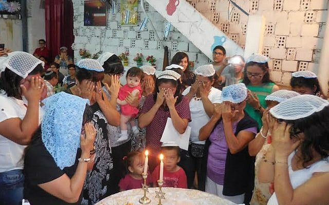The Jewish community of Iquitos lights candles on Rosh Hashanah eve, 2016. (Facebook)
