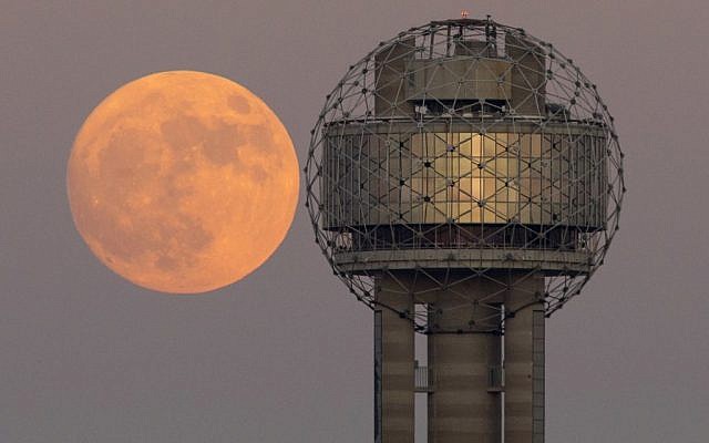 The moon rises behind Reunion Tower in downtown Dallas, Sunday evening, Nov. 13, 2016. On Monday the supermoon is the closest full moon to earth since 1948, and it won't be as close again until 2034. (Tom Fox/The Dallas Morning News via AP) The moon rises behind Reunion Tower in downtown Dallas, Sunday evening, Nov. 13, 2016. On Monday the supermoon is the closest full moon to earth since 1948, and it won't be as close again until 2034. (Tom Fox/The Dallas Morning News via AP)