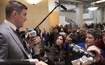 In this Nov. 18, 2016, photo, Richard Spencer, left, talks to the media at an Alt Right conference hosted by the National Policy Institute in Washington. (Linda Davidson/The Washington Post via AP)
