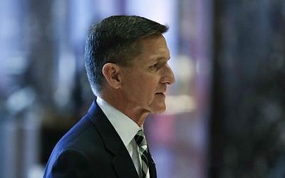 Retired Lt. Gen Michael Flynn walks through the lobby at Trump Tower, Thursday, Nov. 17, 2016, in New York. (AP Photo/Carolyn Kaster)