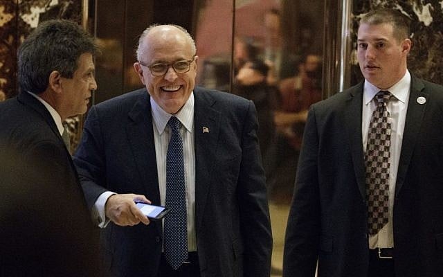 Former New York Mayor Rudy Giuliani, center, smiles as he leaves Trump Tower, Friday, Nov. 11, 2016, in New York. (AP/Evan Vucci) Former New York Mayor Rudy Giuliani, center, smiles as he leaves Trump Tower, Friday, Nov. 11, 2016, in New York. (AP/Evan Vucci)