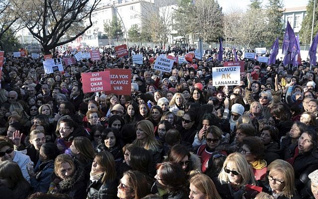 Thousands of members of Turkey's main opposition Republican People's Party march to the parliament in Ankara, Turkey, Tuesday, Nov. 22, 2016. The placards read: " No to exploitation of children " and " The rape cannot be legalized." (AP Photo/Burhan Ozbilici)
