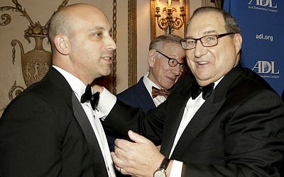 In this Wednesday, June 17, 2015 file photo, Jonathan Greenblatt, left, incoming national director for the Anti-Defamation League, talks with Abe Foxman, outgoing director of the ADL, in New York. (AP Photo/Julie Jacobson)