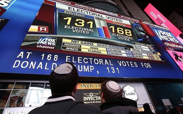 People watch the election results, in Times Square in New York City, USA, on November 8, 2016. (Noam Revkin FentonFlash90)