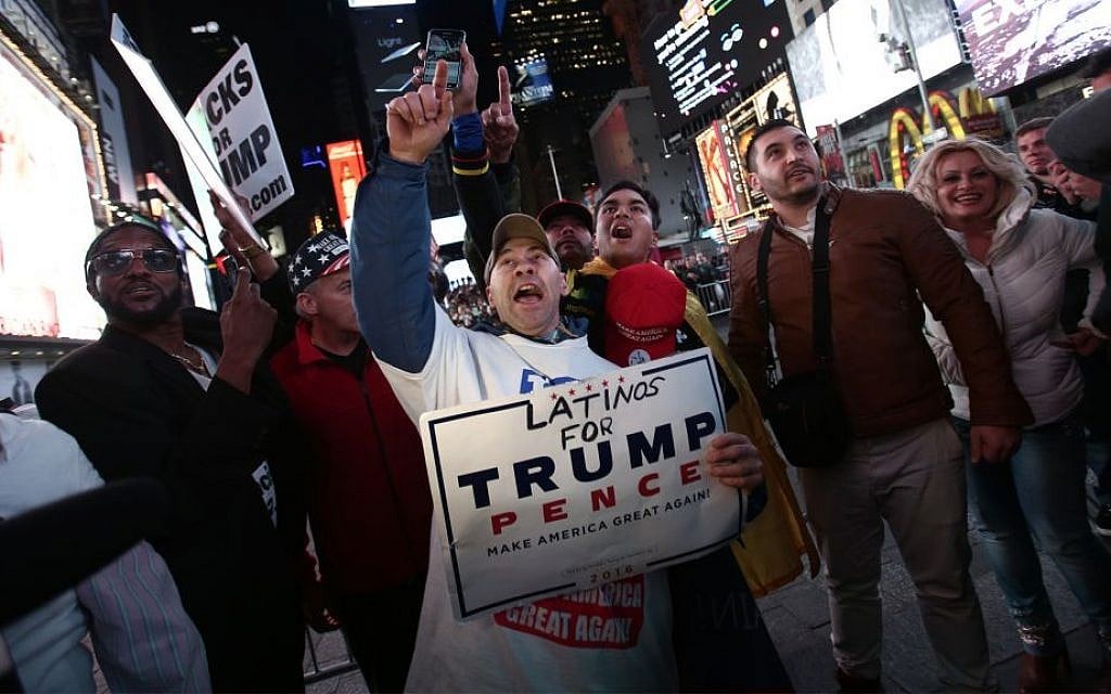 Dondald Trump supporters demonstrate as they watch election results in Times Square in New York City on November 8, 2016. (Noam Revkin FentonFlash90) Dondald Trump supporters demonstrate as they watch election results in Times Square in New York City on November 8, 2016. (Noam Revkin FentonFlash90)