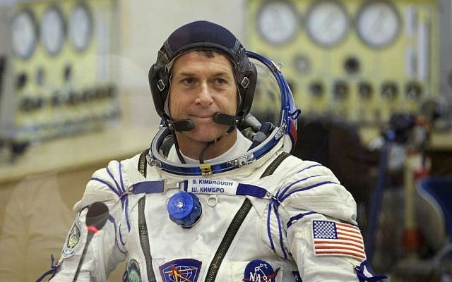 In this Wednesday, Oct. 19, 2016, file photo, US astronaut Shane Kimbrough, a member of the main crew to the International Space Station (ISS), talks to his relatives prior to the launch of the Soyuz MS-02 space ship, in Russian leased Baikonur cosmodrome, Kazakhstan. (AP Photo/Ivan Sekretarev, Pool, File)