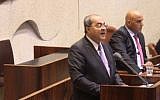 Joint List MK Ahmad Tibi sings the Muslim call to prayer on the podium of the Knesset on November 14, 2016, to protest proposed legislation that would silence the call to prayer in early mornings (Joint List)