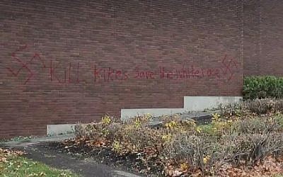 Swastikas and the words 'kill kikes save the white race' appear on the side of the building of the Machzikei Hadas synagogue in Ottawa, November 2016. (Screenshot)