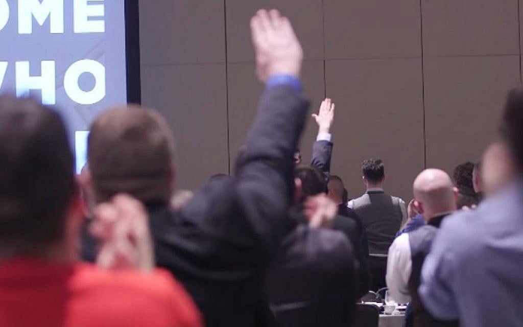 Attendants at the National Policy Institute's annual conference give Nazi salutes as NPI head Richard Spencer speaks of white supremacy, on November 19, 2016 (YouTube screenshot)