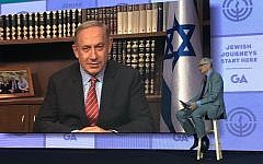 Prime Minister Benjamin Netanyahu, on screen, being interviewed by Richard Sandler at the Jewish Federations of North America’s General Assembly, November 15, 2016. (Ron Sachs)