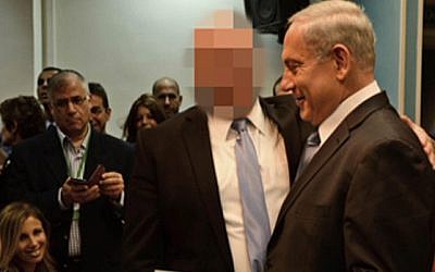 Prime Minister Benjamin Netanyahu with the close associate accused of violence and sexual assault against an artist (Screenshot, Channel 2 News).